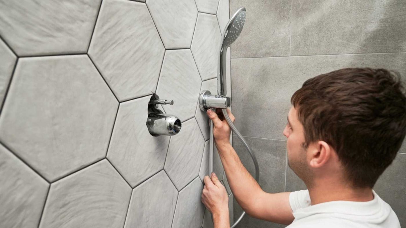 Man Fixing Showerhead
