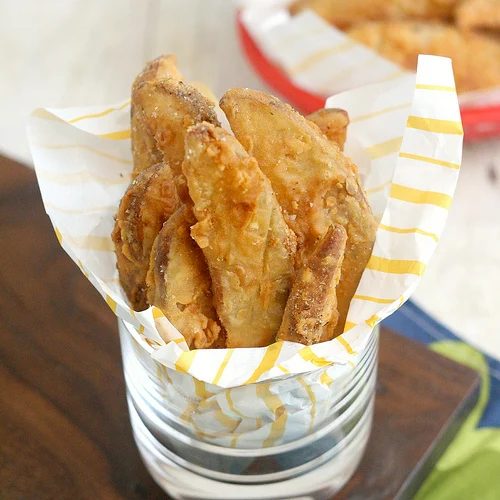 Banish boring potato sides and give your next party a punch by making one of these flavorful potato wedge recipes. 10 Flavorful Potato Wedge Recipes ~ Tipsaholic.com #sides #potato