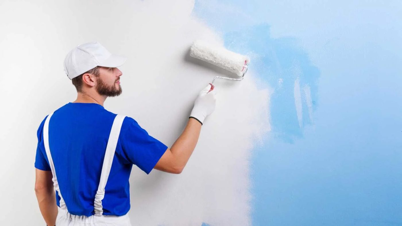 Man Painting The Wall