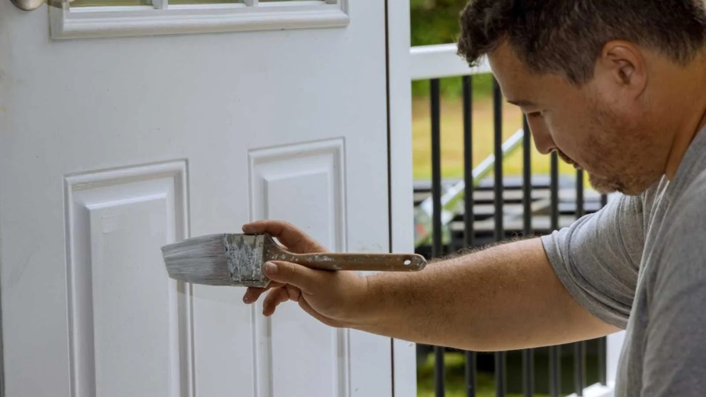 Man Painting Front Door