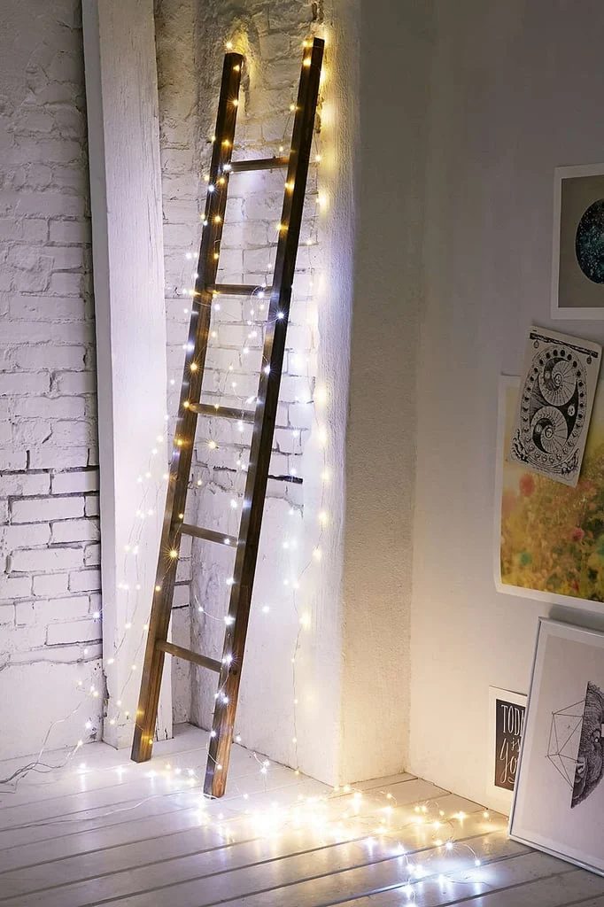 Wood Ladder Decor option With Lights For Nightlight Or Christmas, Via Urban Outfitters