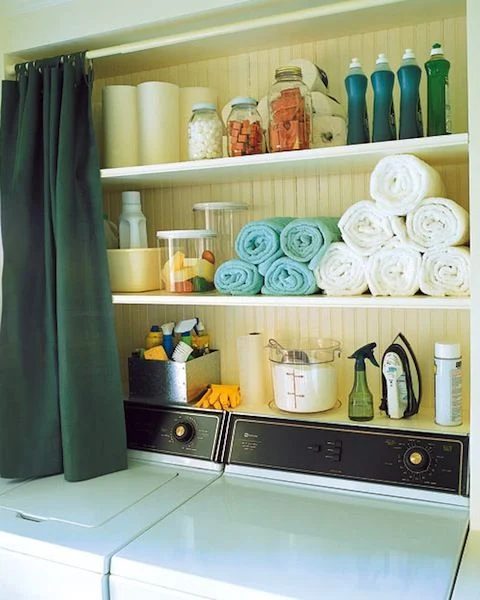 Organized shelves above washing machine