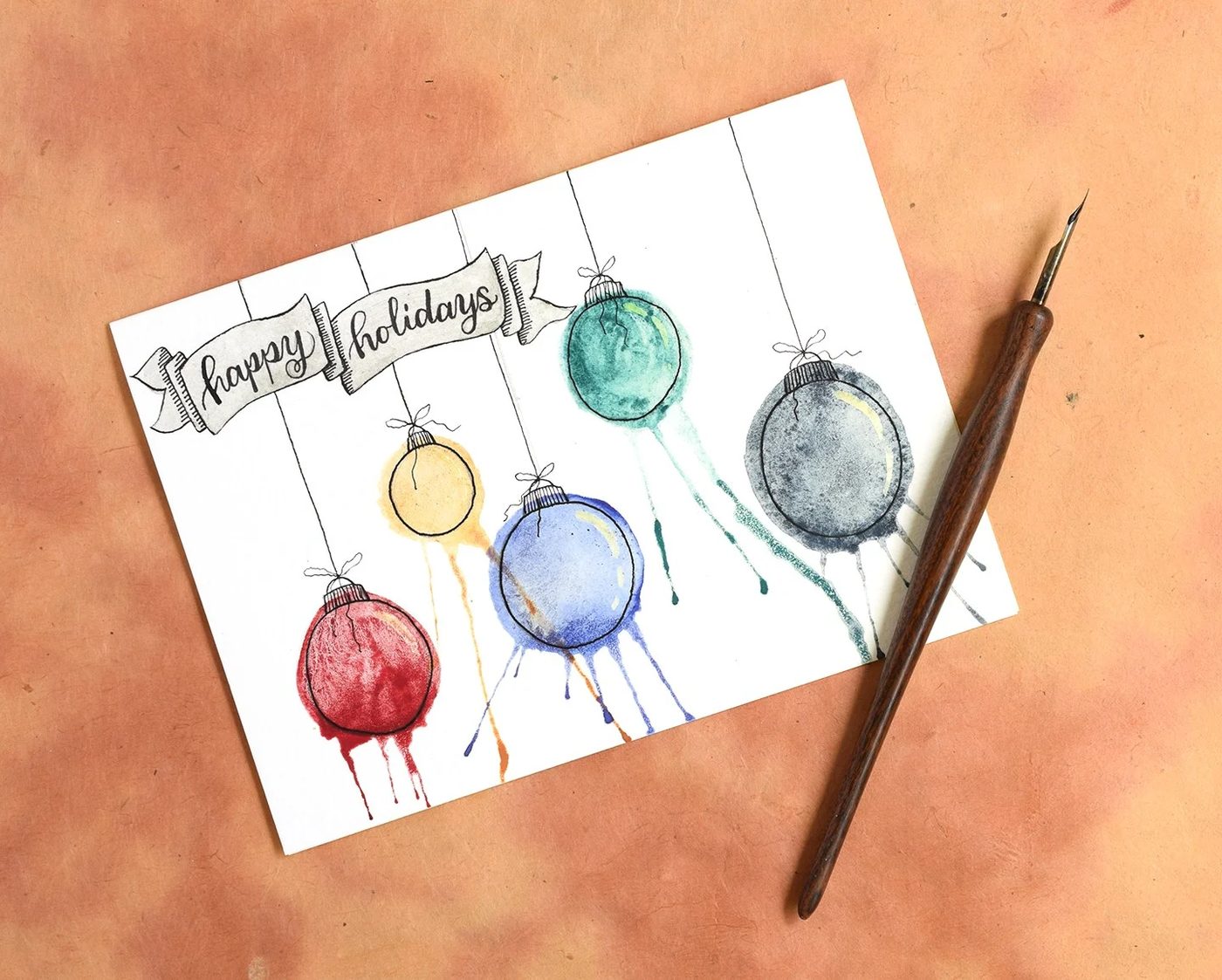 Water color Ornaments card. Send some handmade sentiments to your family and friends this Christmas season. Use one of these 11 straightforward Handmade Christmas Cards featured on