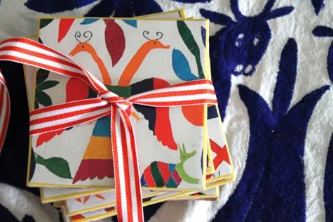 Reuse old calendar pages to create colorful coasters.