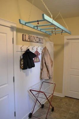 laundry room organization -- reuse a ladder as a laundry drying rack