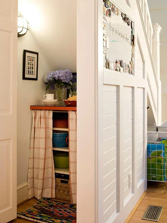 storage pantry closet under the stairs via BHG