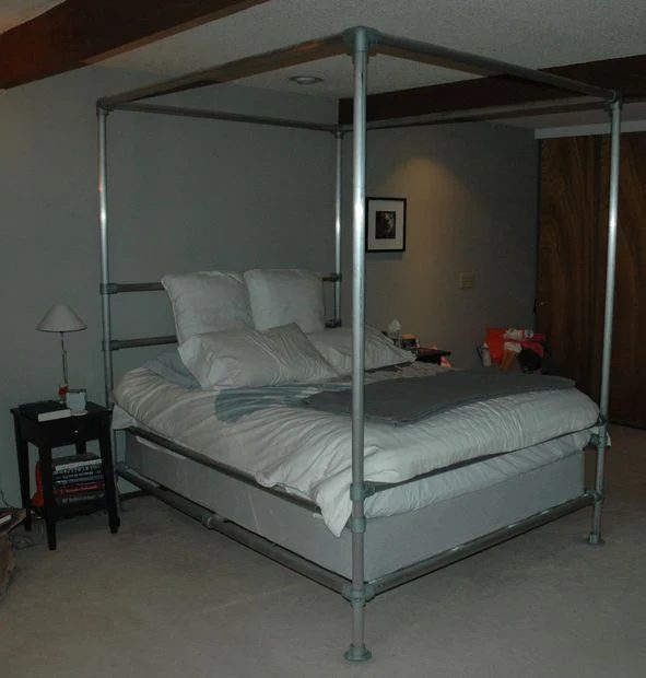 Metal plumbing pipes can be used to build many memorable things, from a clothes rack to a canopy bed! 15 Fabulous Handmade Plumbing Pipe Projects via tipsaholic.com #plumbingpipe #
