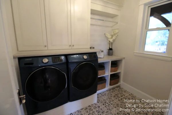 White Laundry Room with Patterned Tile Floor