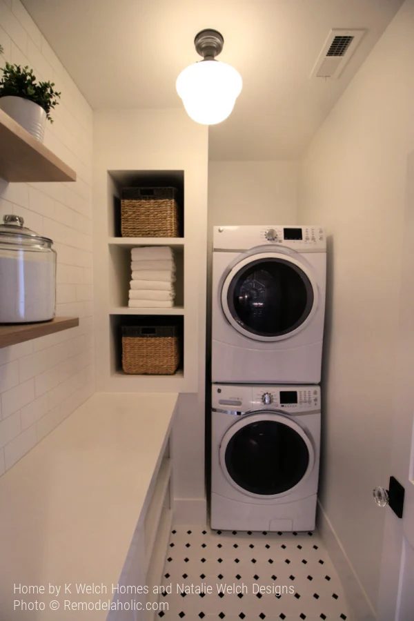 Small Laundry Room with Stacked Machines and Floating Shelves