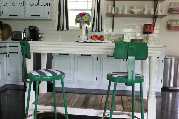 renovated kitchen with subway tile backsplash, painted cabinets, and custom island, Rain On A Tin Roof featured on Bekob