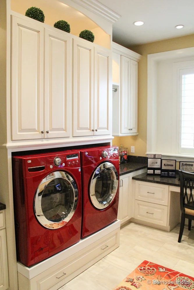 Raised front loading washing machines and dryers with drawer beneath. Fabulous Laundry room design options from @Bekob