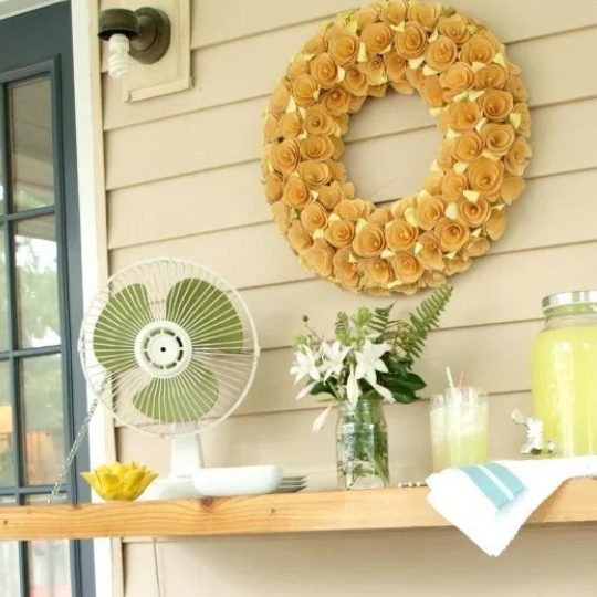 vivid Wooden Drop Down Attached To Side Of House With Yellow Wreath Above