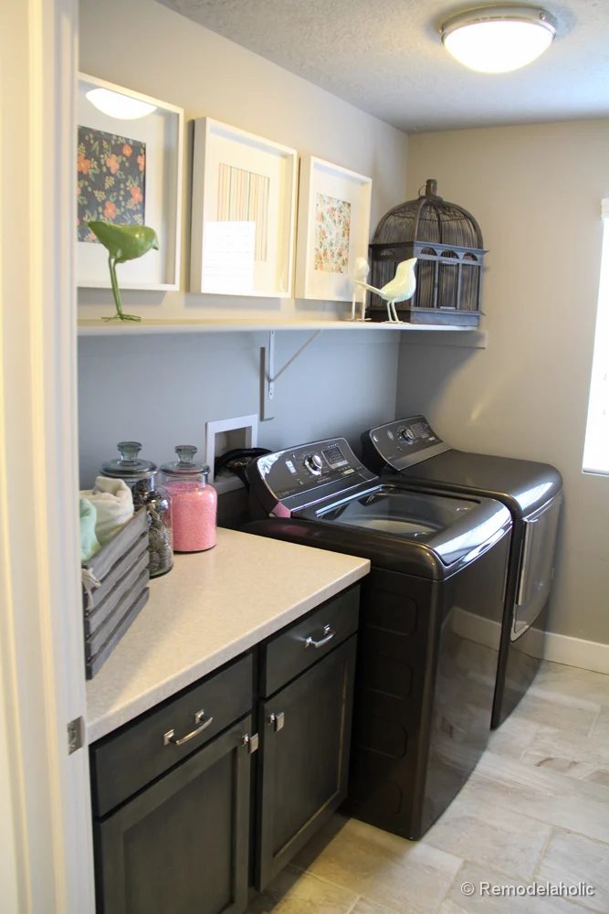 A shelf for storage or decor and a tabletop for folding in a small laundry room. Fabulous Laundry room design options from @Bekob