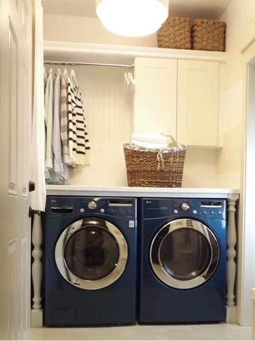 Fun detail with newel posts and counter and air drying laundry room featured on Bekob.com