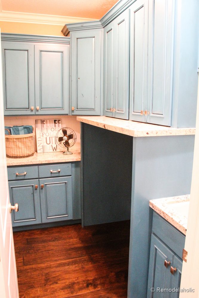 Fabulous Laundry room design options from @BekobPretty blue cabinets with a built in area for the machines.