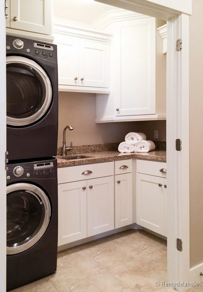 Small laundry room with a sink and lots of storage with cabinets from floor to ceiling. Fabulous Laundry room design options from @Bekob