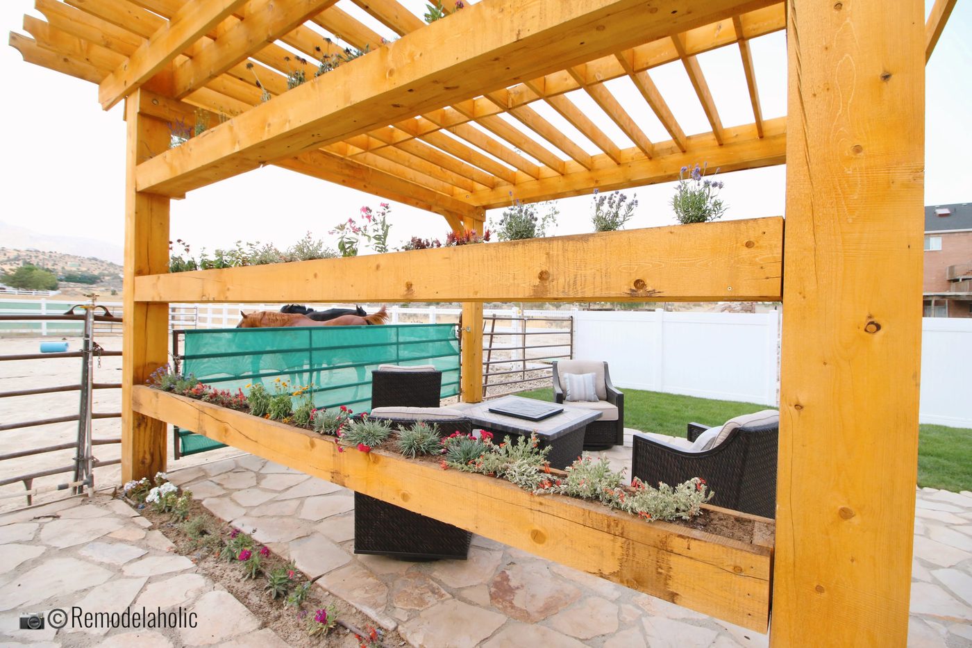 Pergola with planter boxes and seating area, SLPH 2018 Home 17 Green Haven Homes, Photo by Bekob
