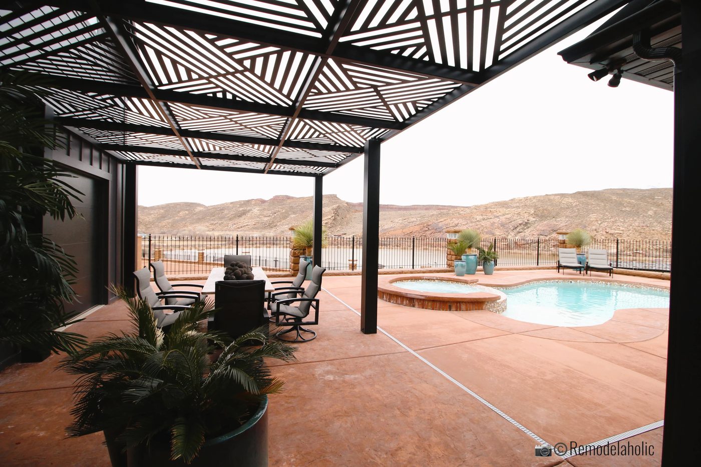 Modern style black pergola with design tiles and dining area, SGPH 2019 House 04 Interstate Homes, Photo by Bekob