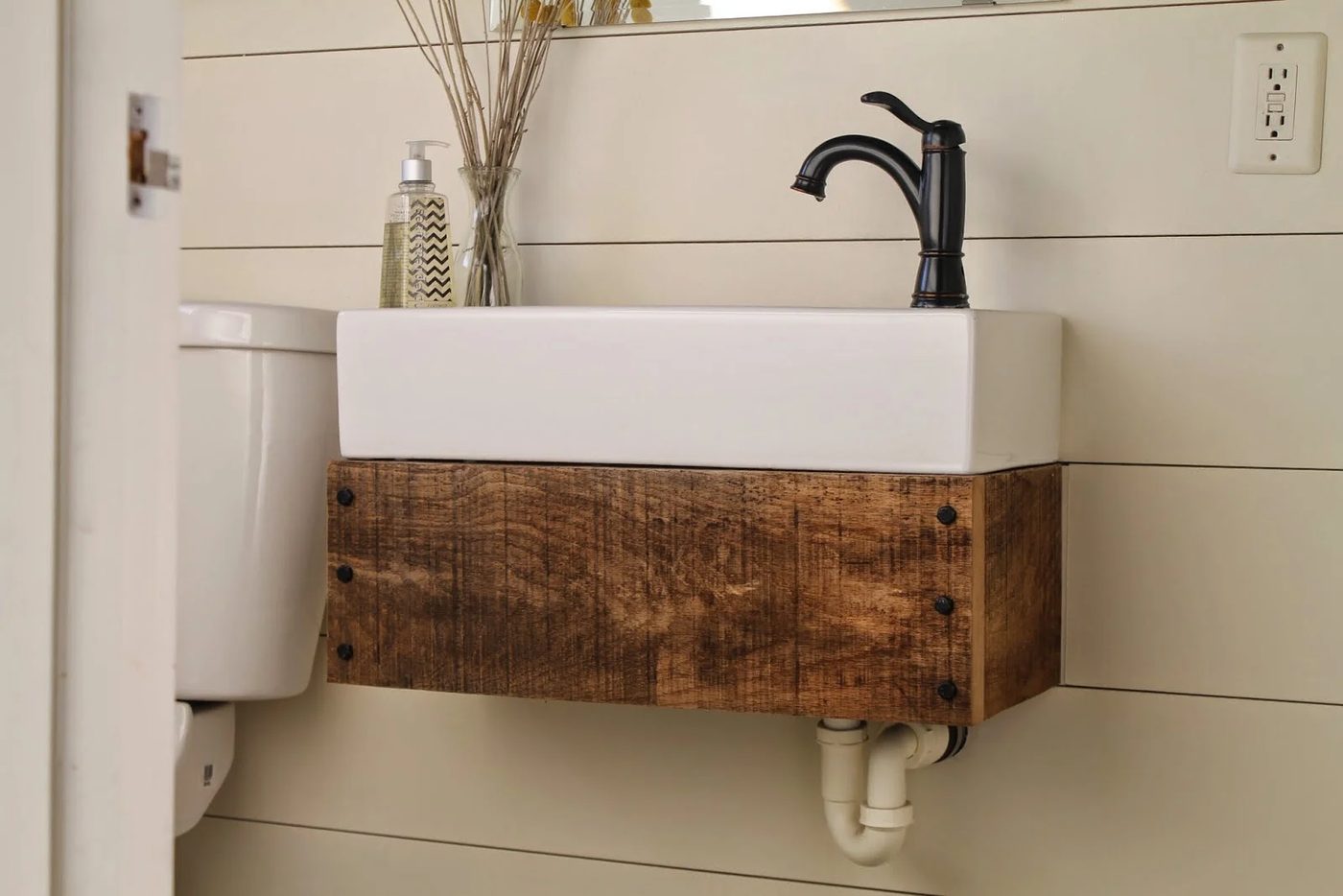 handmade floating reclaimed wood vanity with IKEA sink - Girl Meets Carpenter featured on @Bekob
