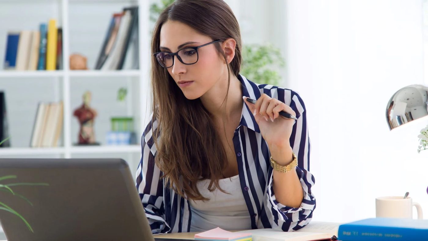 Woman Working In Home Office Closet