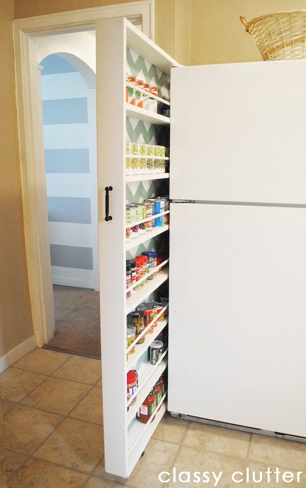 hidden pantry storage by fridge