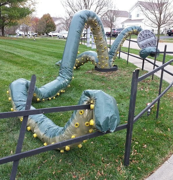 Giant Tentacle Halloween Decorations for the yard featured in 25 Clever Outdoor Halloween Decorations - Bekob.com. #Halloween, #decorations, #halloweendecor, #Halloweendiy, #spook