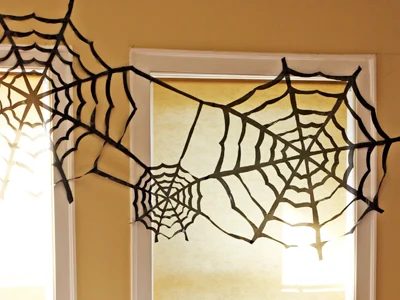 Black Plastic Bags are well fitted for creating creepy spider webs for indoor or outdoor decorating - How About Orange