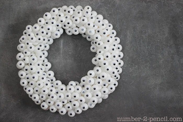 Eyeball Wreath by Number 2 Penciel - 25 Clever Outdoor Halloween Decorations - Bekob.com #Halloween, #decorations, #halloweendecor, #Halloweendiy, #spooky