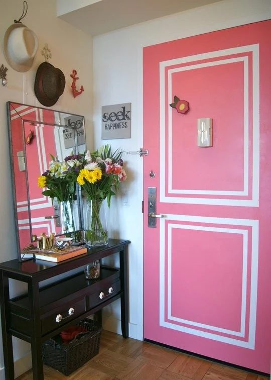 Faux painted moldings on a pink door