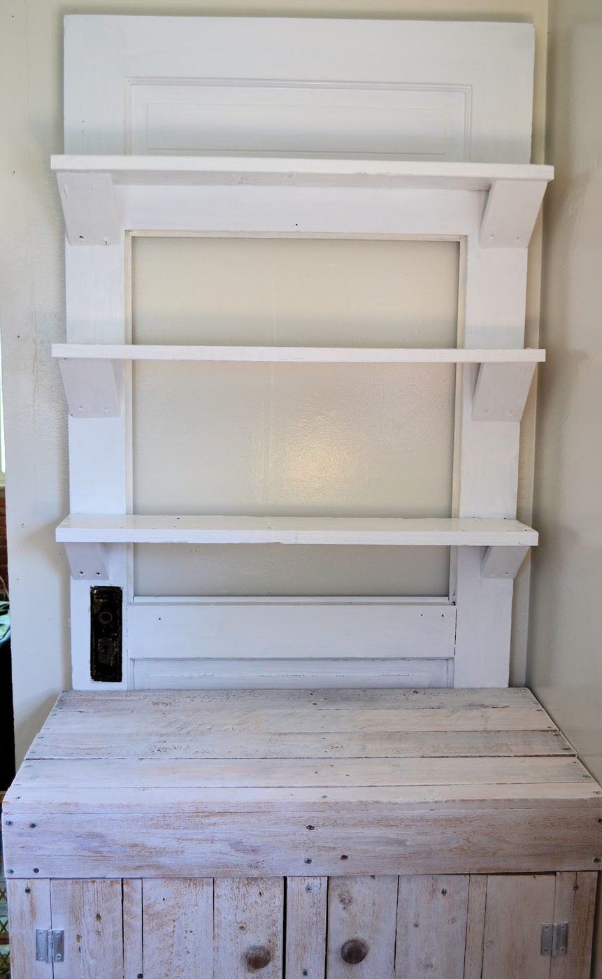 old door turned into shelf wall display