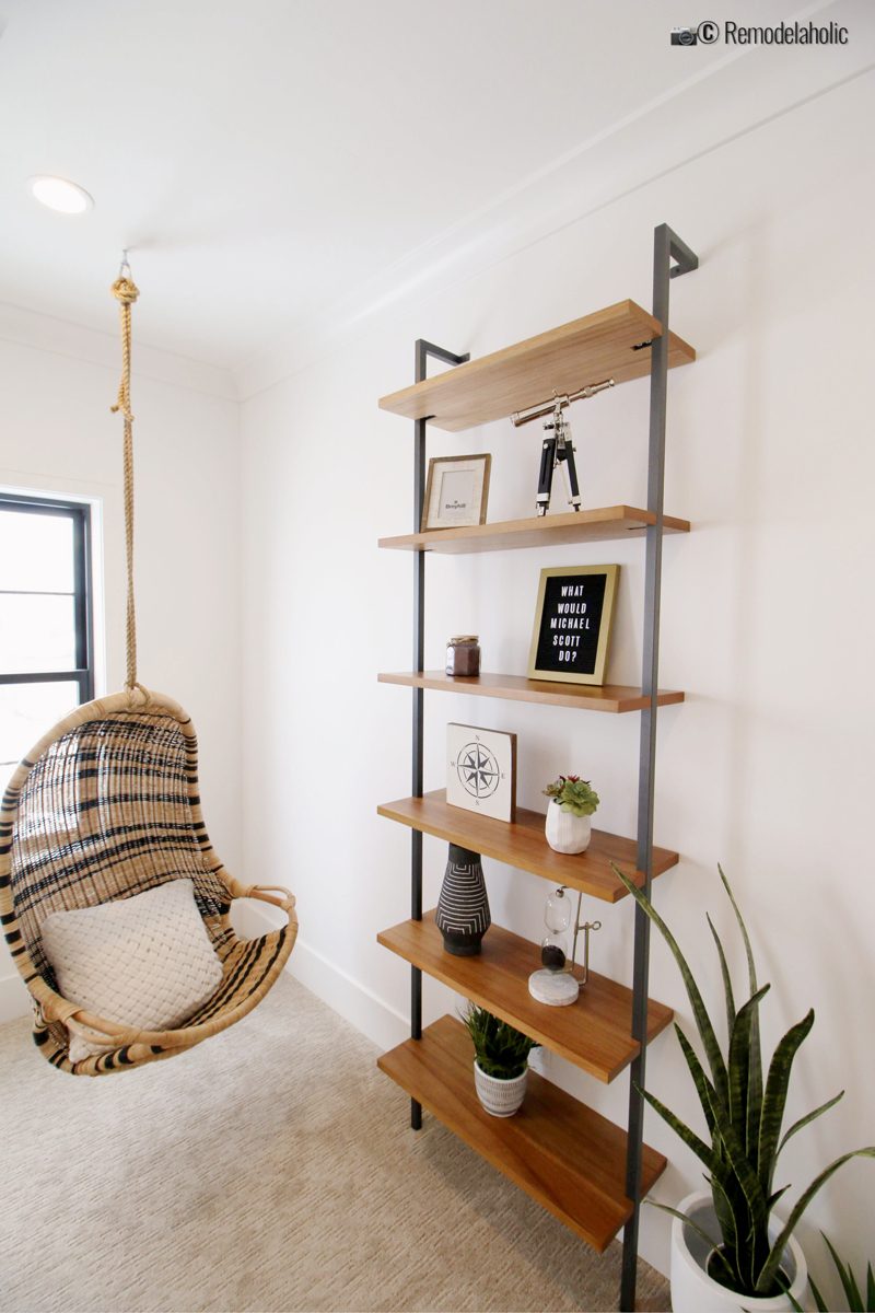 A cute compliment to an office with a striped rattan chair and styled shelves. SGPH 2019 House 24 K Welch Homes, photo by Bekob.com