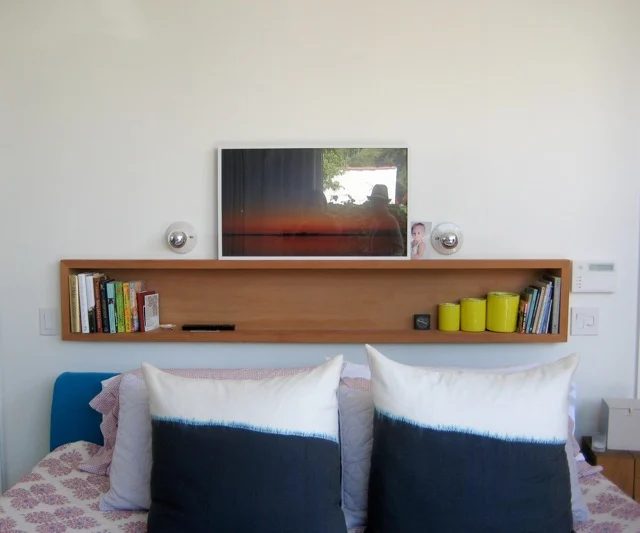 bookshelf-and-art-above-bed-you-are-the-river