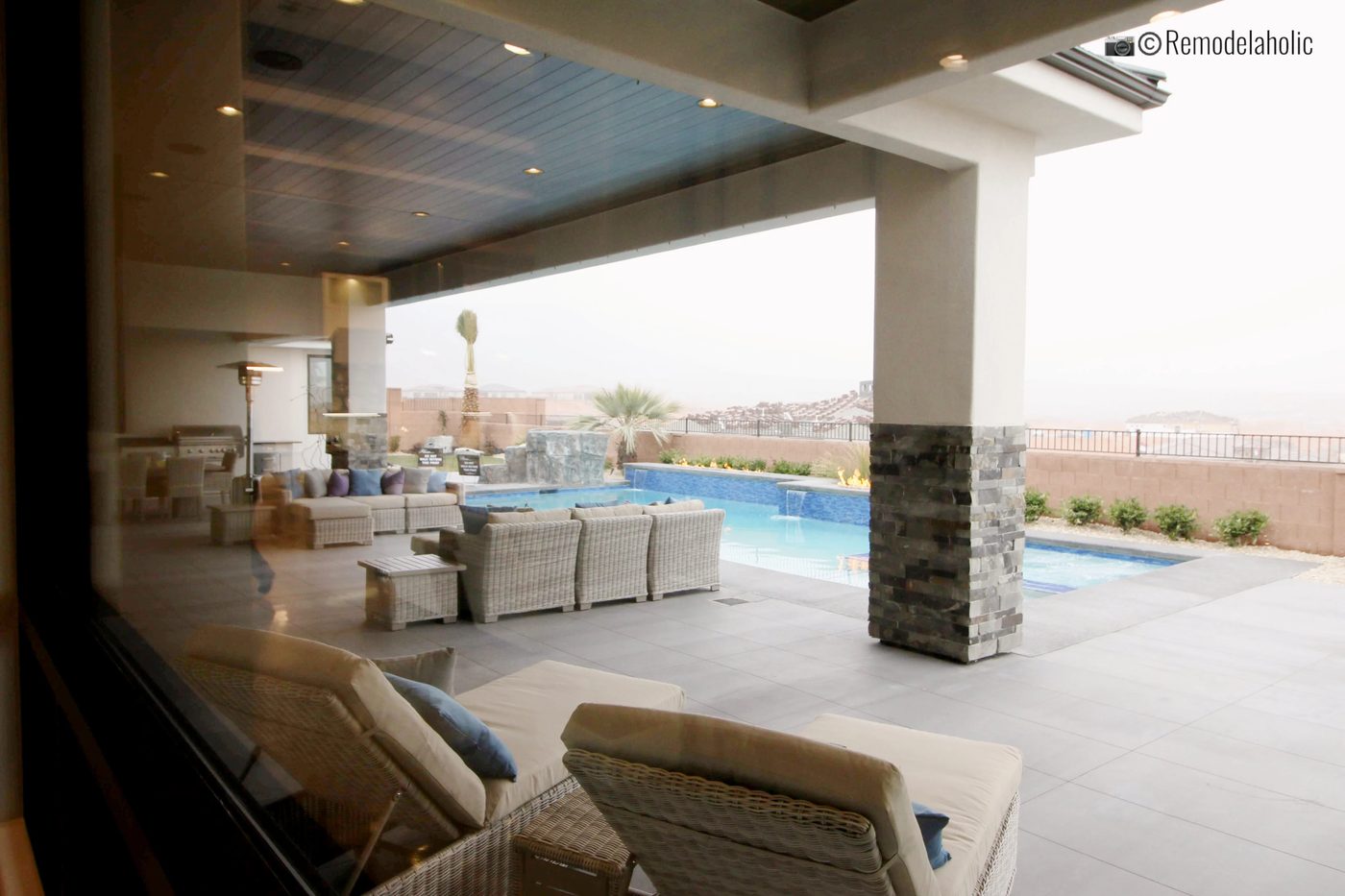 Add comfy chairs around the pool to relax in! SGPH 2019 House 11 Anderson Custom Homes, Photo by Bekob