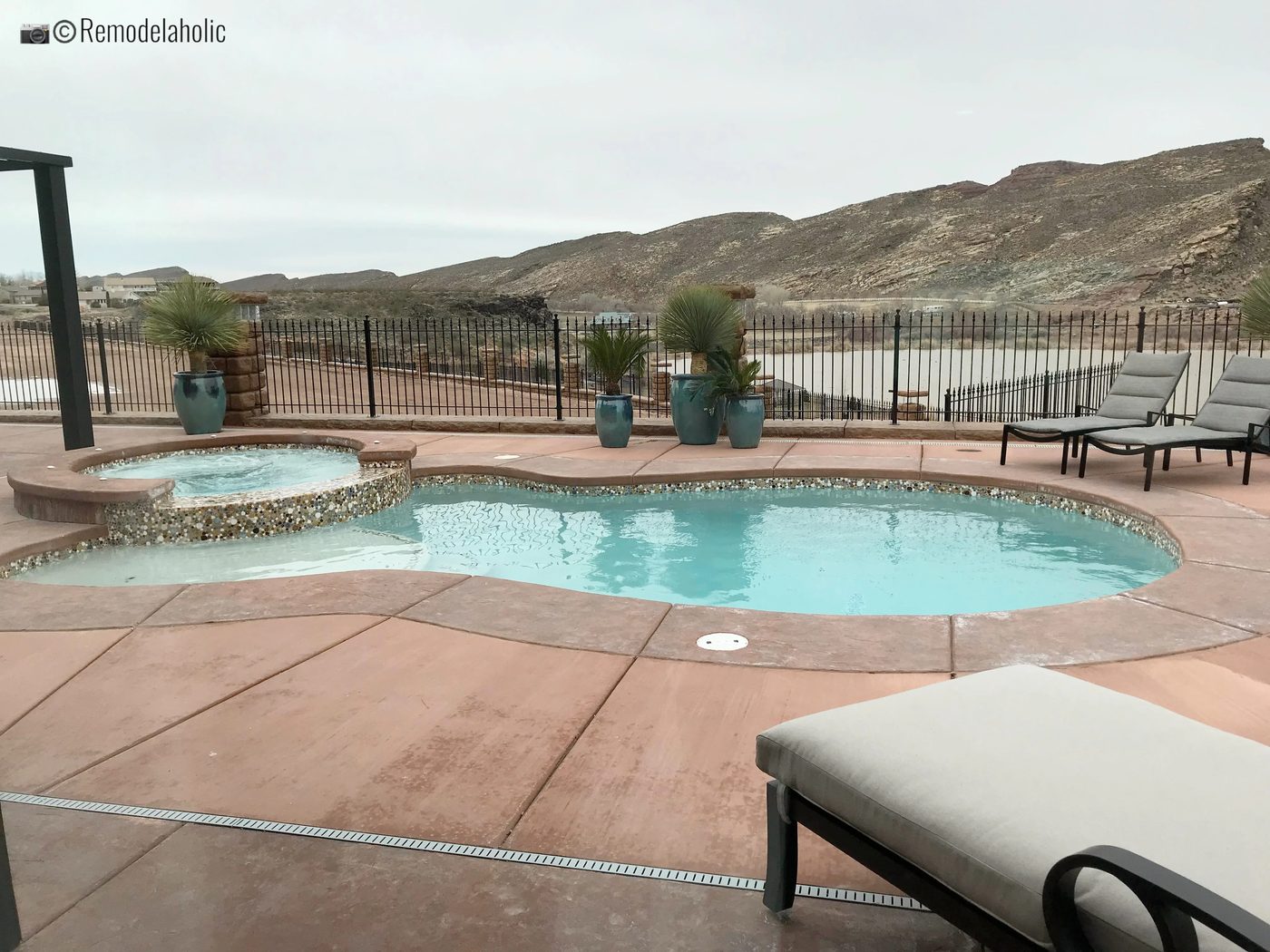 Lounge Chairs around the swimming pool. SGPH 2019 House 04 Interstate Homes, Photo by Bekob
