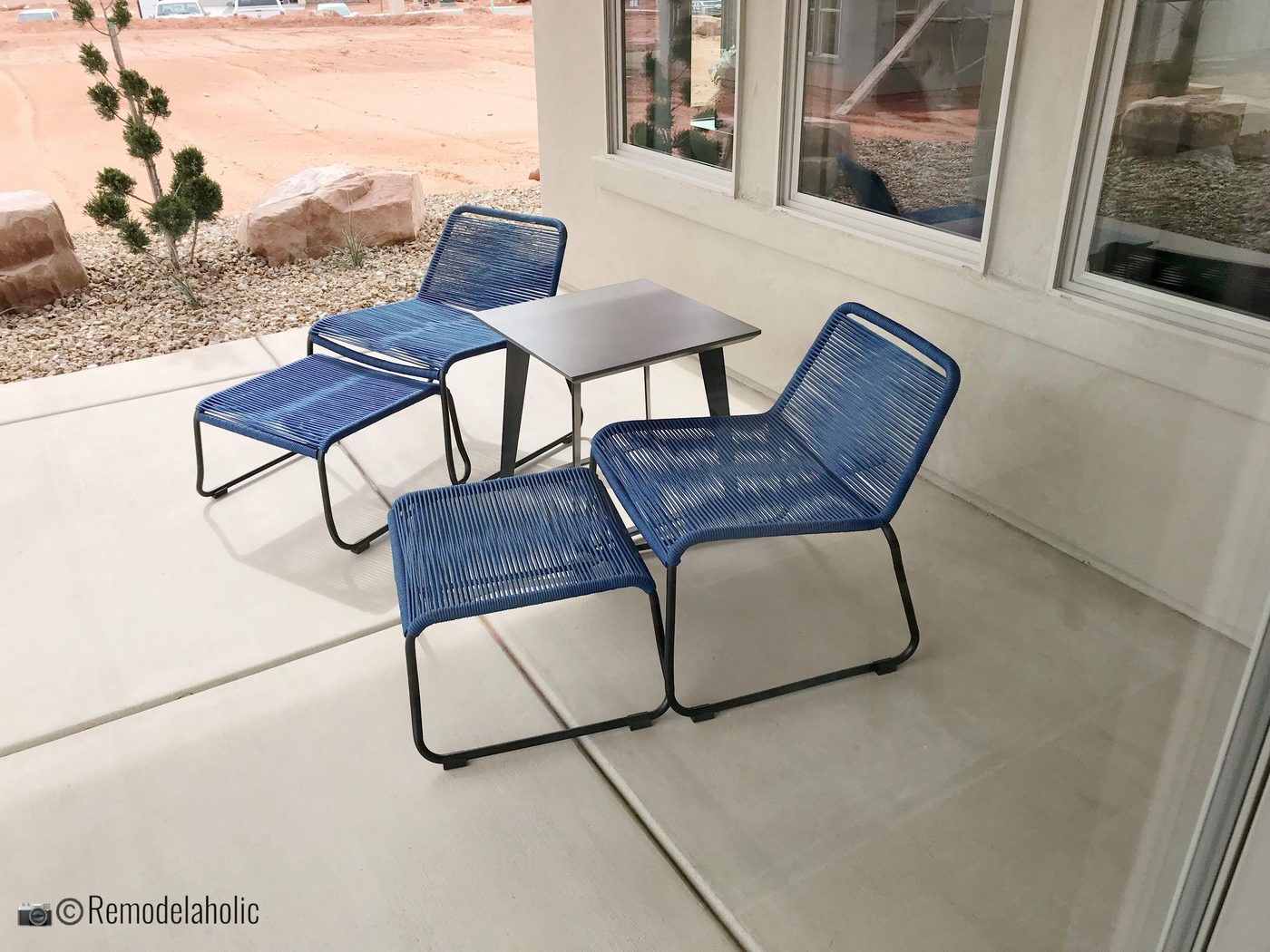 Modern blue patio chairs, SGPH 2019 House 02 Ivory Homes, LTD, Photo by Bekob