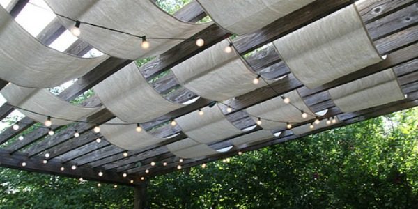 drop cloth sail pergola update with outdoor string lights