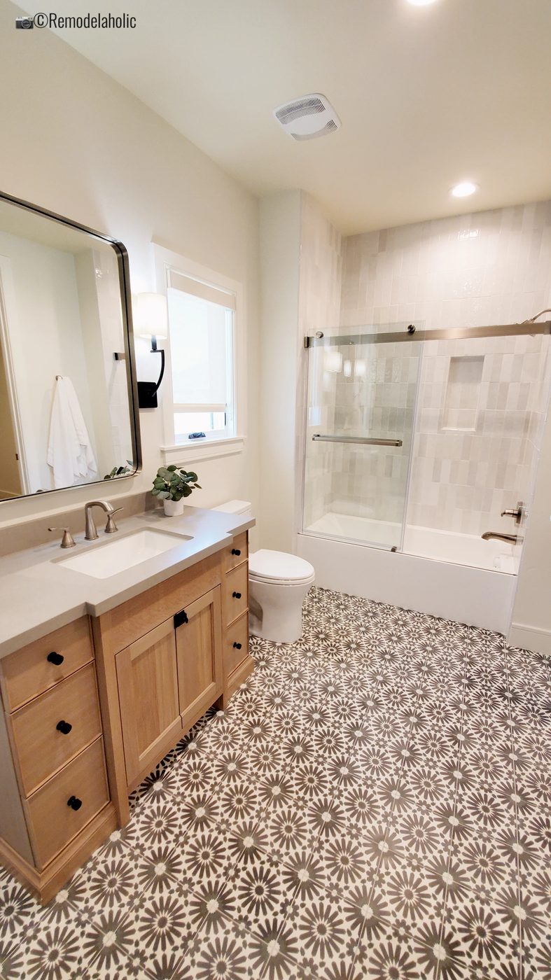 Pattern floor tiles in a master bathroom. UVPH 2021 Home 01 Regent Custom Homes Designer Olsen Homes Interior Design, Photo by Bekob