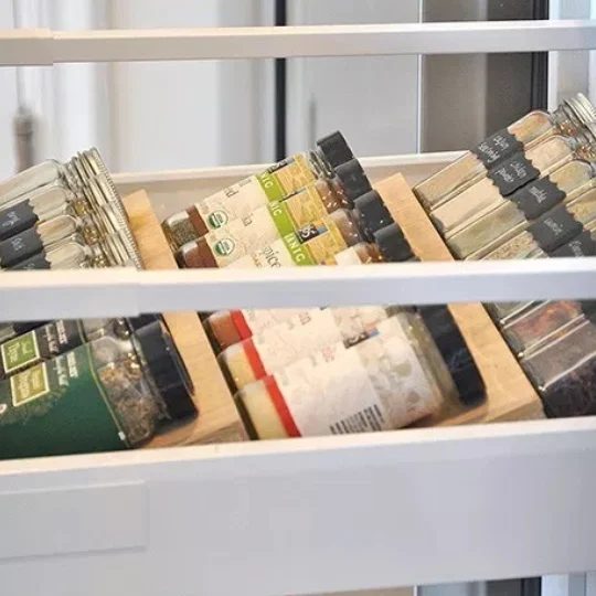 Kitchen Drawer Pulled Out To Display Rows Of Spice Jars, straightforward Access, straightforward Readability