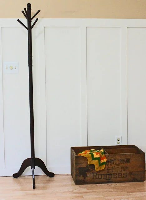 living room with tall board and batten wainscoting, Superwoman on Bekob