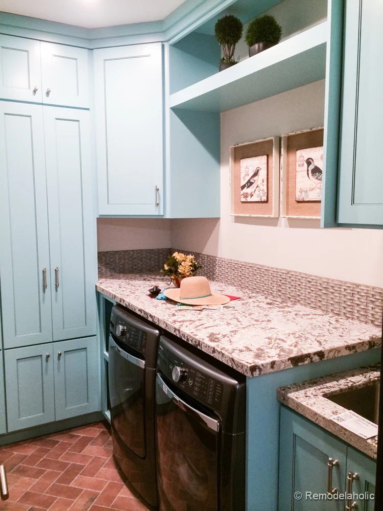 Blue cabinets and brick floor for a unique laundry area. Fabulous Laundry room design options from @Bekob