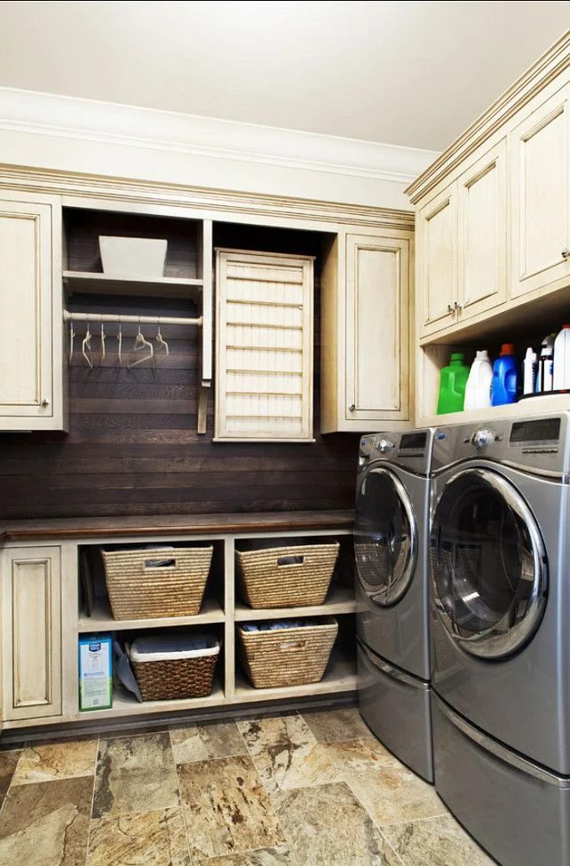 laundry with lots of storage space and hanging rack featured on Bekob.com