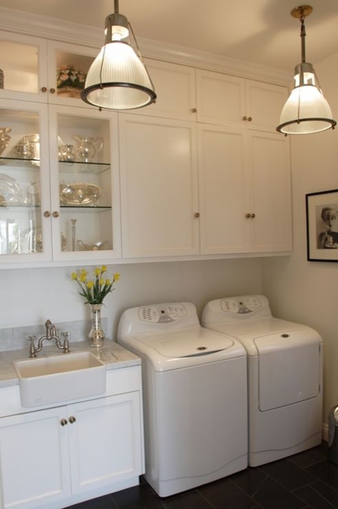 Tall ceilings laundry room with fancy touches featured on Bekob.com