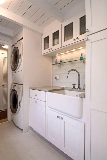 Stacked laundry with sink for hand washing and lots of storage featured on Bekob.com