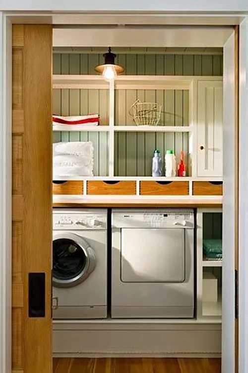 Beach vibe laundry room full over extra storage and charm featured on Bekob.com