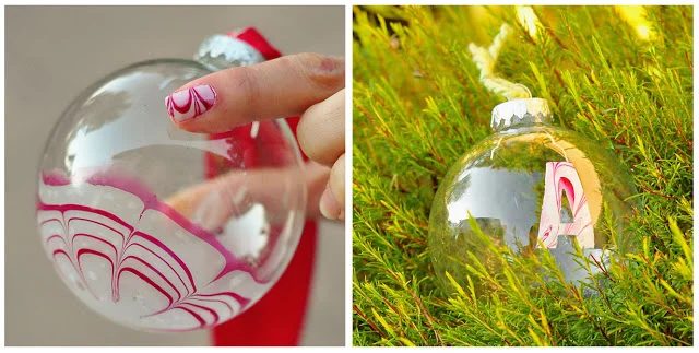 Candy Cane Marble Painted Ornaments - Try these 35+ Handmade options for clear glass ornaments to add precious memories and lots of spirit to your Christmas tree! from @tipsaholic 