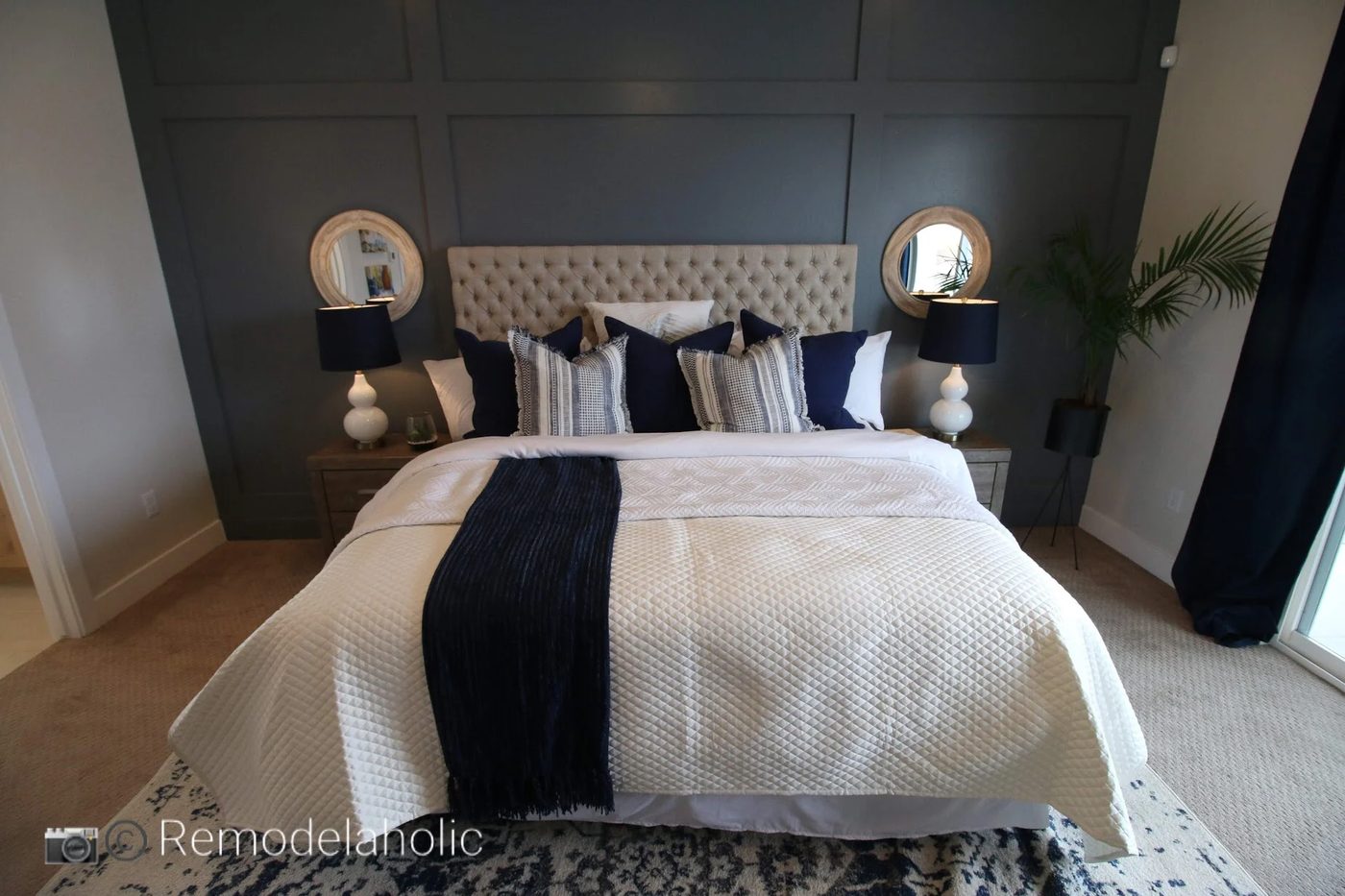 Add some symmetry with a mirror on each side of the bed photo by Bekob