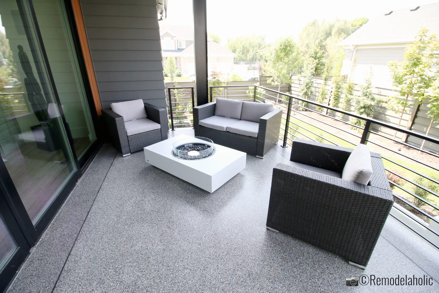 Small patio loveseat set up. SLPH 2018 Home 3 Breen Homes, Photo by Bekob