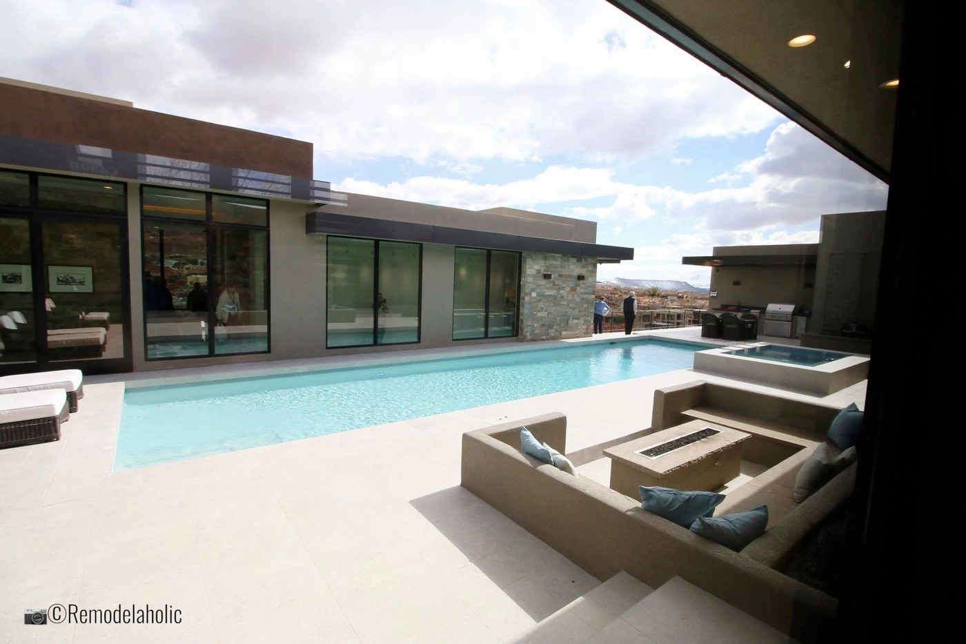 Add a sectional poolside for a place to relax. SGPH 2019 House 15 Split Rock Custom Homes, Photo by Bekob
