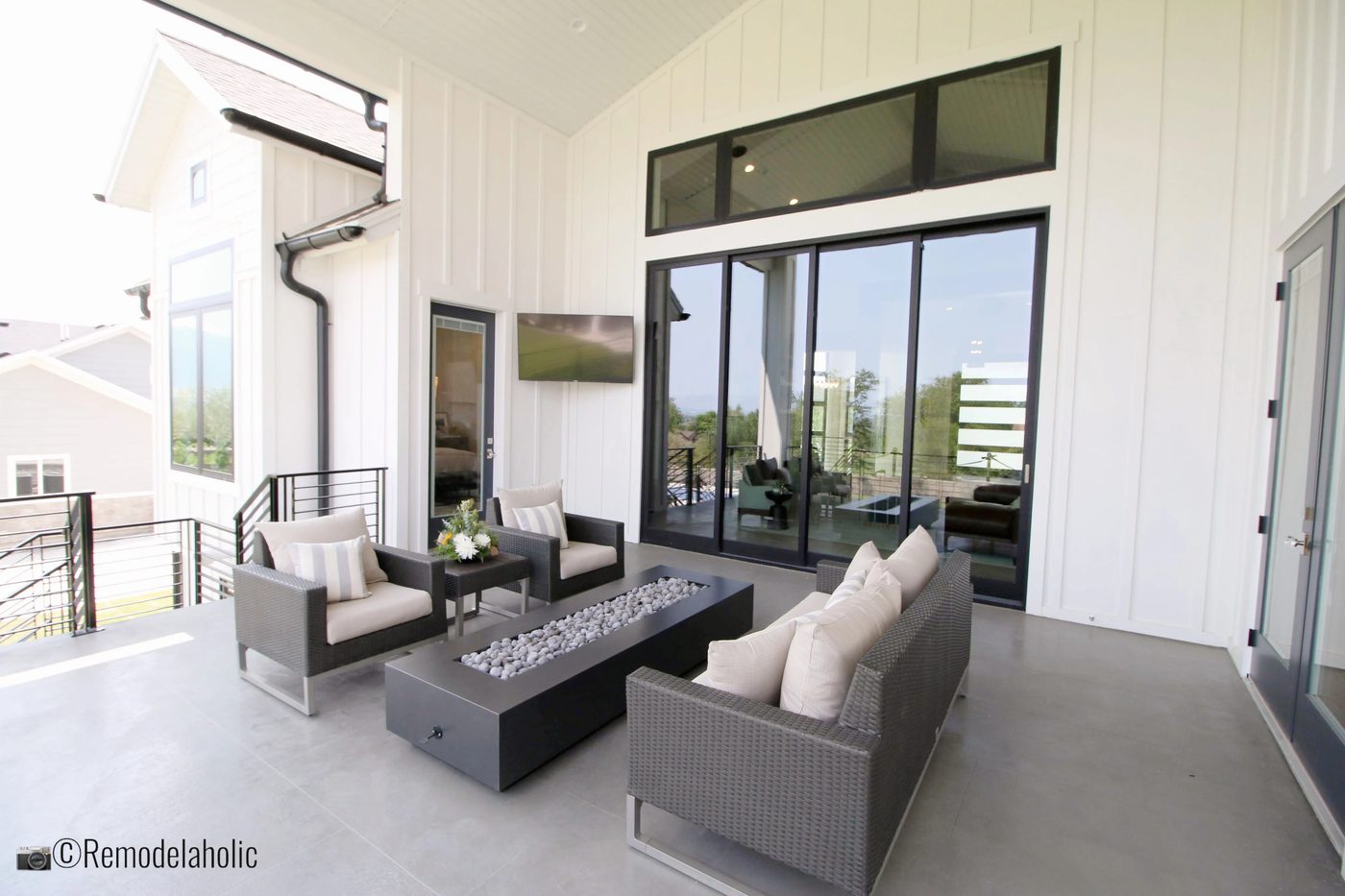 Symmetrical outdoor lounge space. SLPH 2018 Home 9 Alair Homes, Photo by Bekob