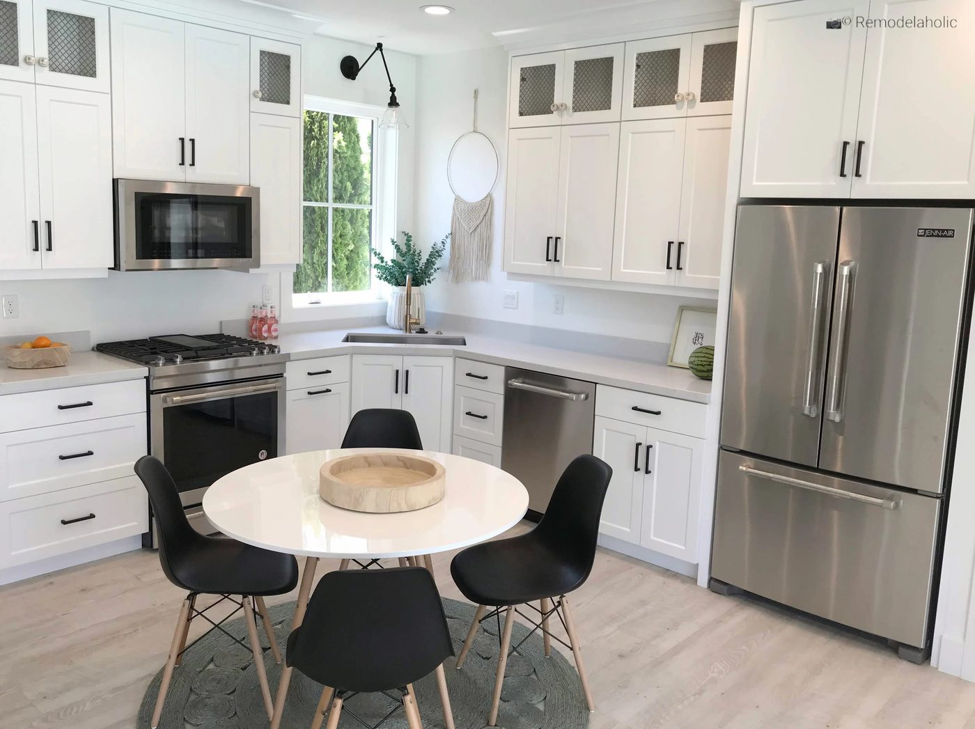 Black modern dining chairs in a white kitchen breakfast nook, UVPH 2018 Home 17 Millhaven Homes, Four Chairs Furniture & Design, photo by Bekob